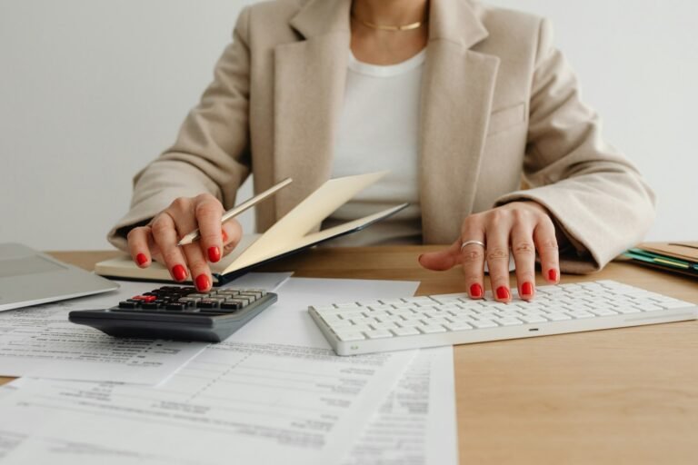 Bookkeeper reviewing financial records while using Accounting Software for Small Business in Excel