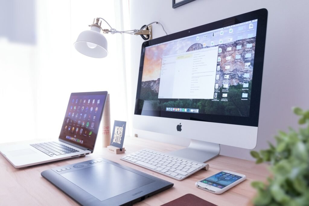 A clean and organized freelance desk setup with folders and documents well laid out
