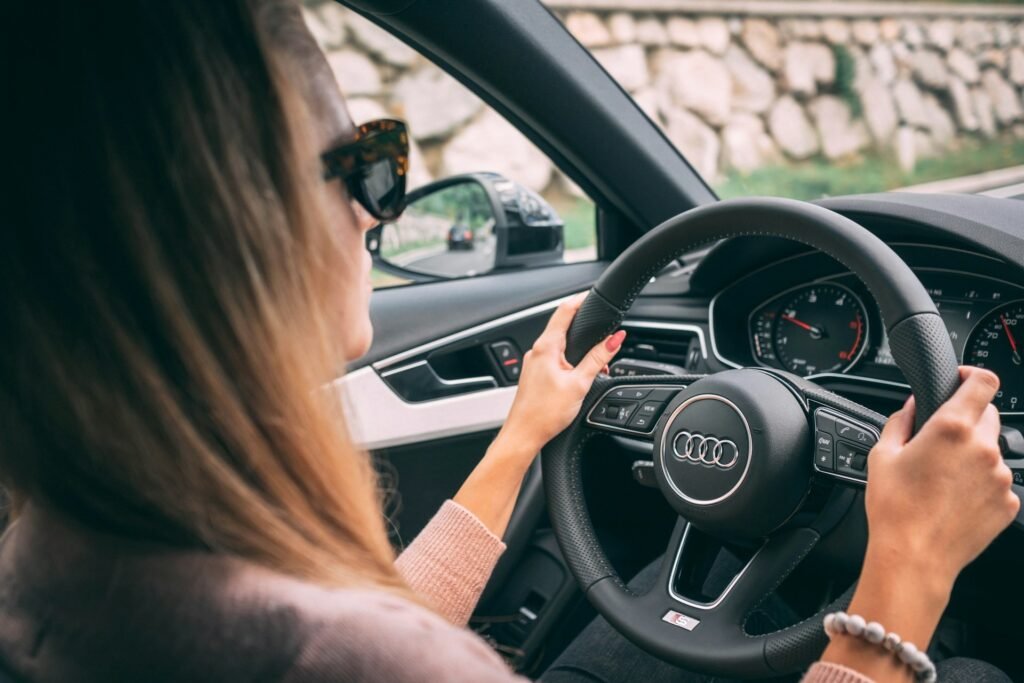 Freelancer driving her car, illustrating the business mileage deduction