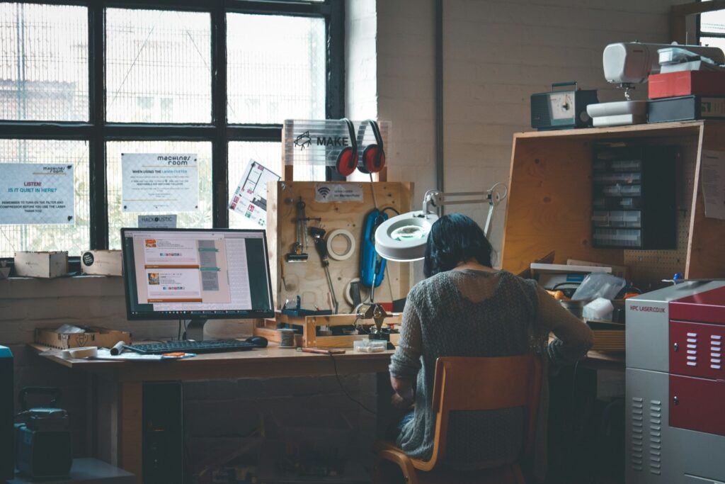 Freelancer at a wooden desk, building a steady system for doing client work