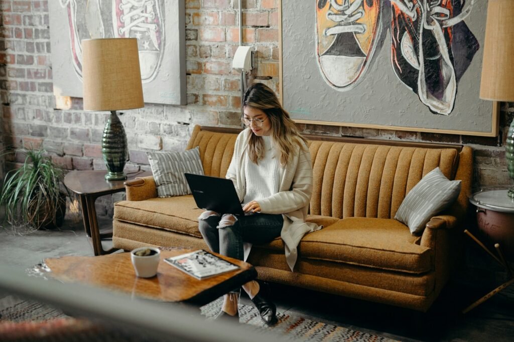 Freelancer working on a laptop while keeping a steady stream of new work coming in
