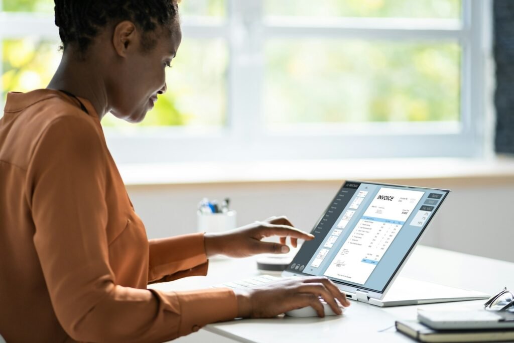Digital invoice displayed on a laptop screen as part of a freelancer invoice management system
