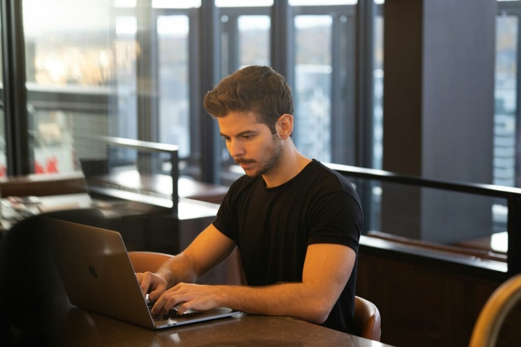 Freelancer writing a clear invoice email with a subject line and payment details