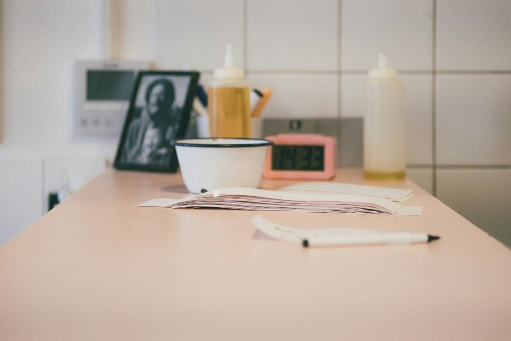 Freelancer's desk with a coffee cup and receipts ready for scanning before tax time