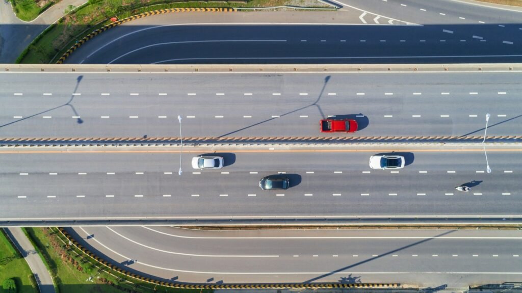 Aerial view of cars driving along a multi-lane highway